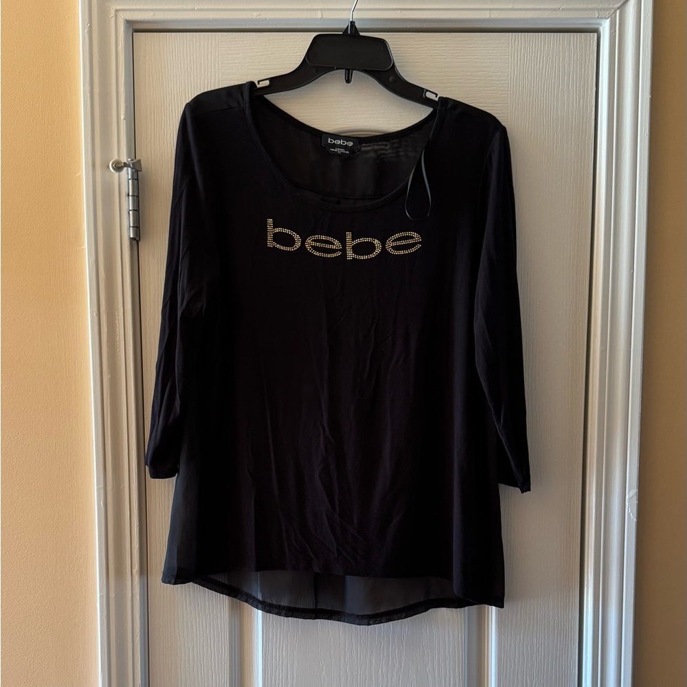 Sheer Bebe blouse.